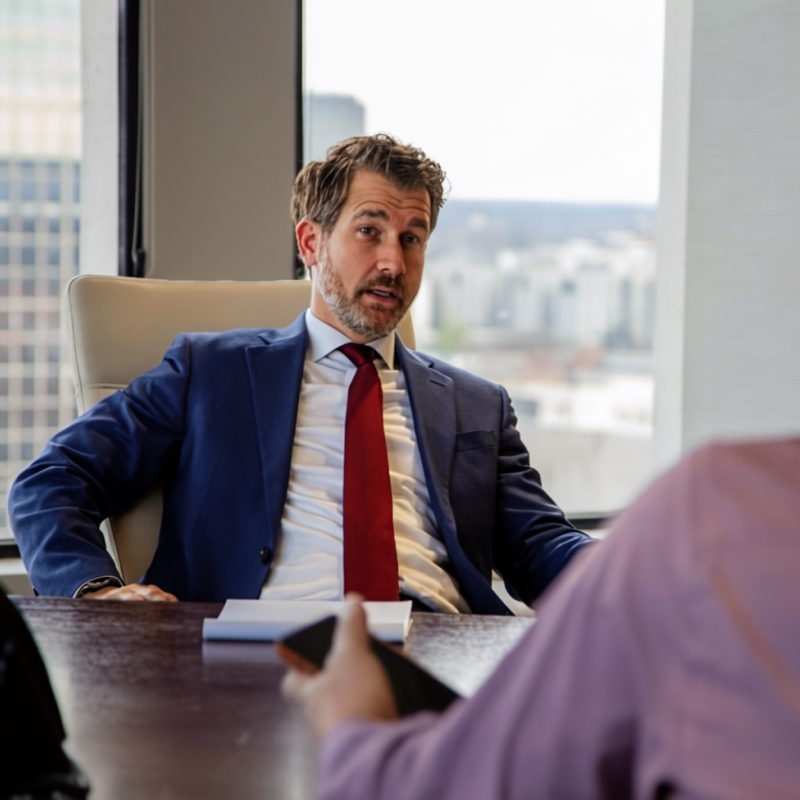 Matthew Farra criminal defense attorney discussing case with client in Louisville Kentucky law office