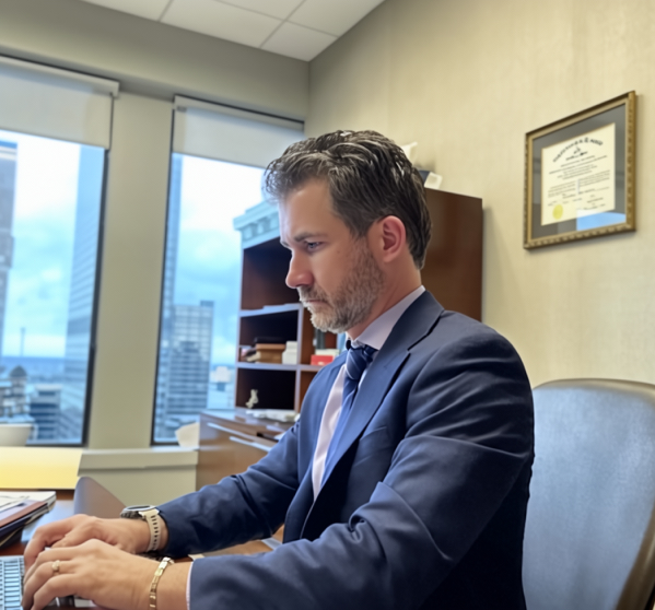 Matthew Farra, Louisville Kentucky criminal defense attorney, standing in his law office